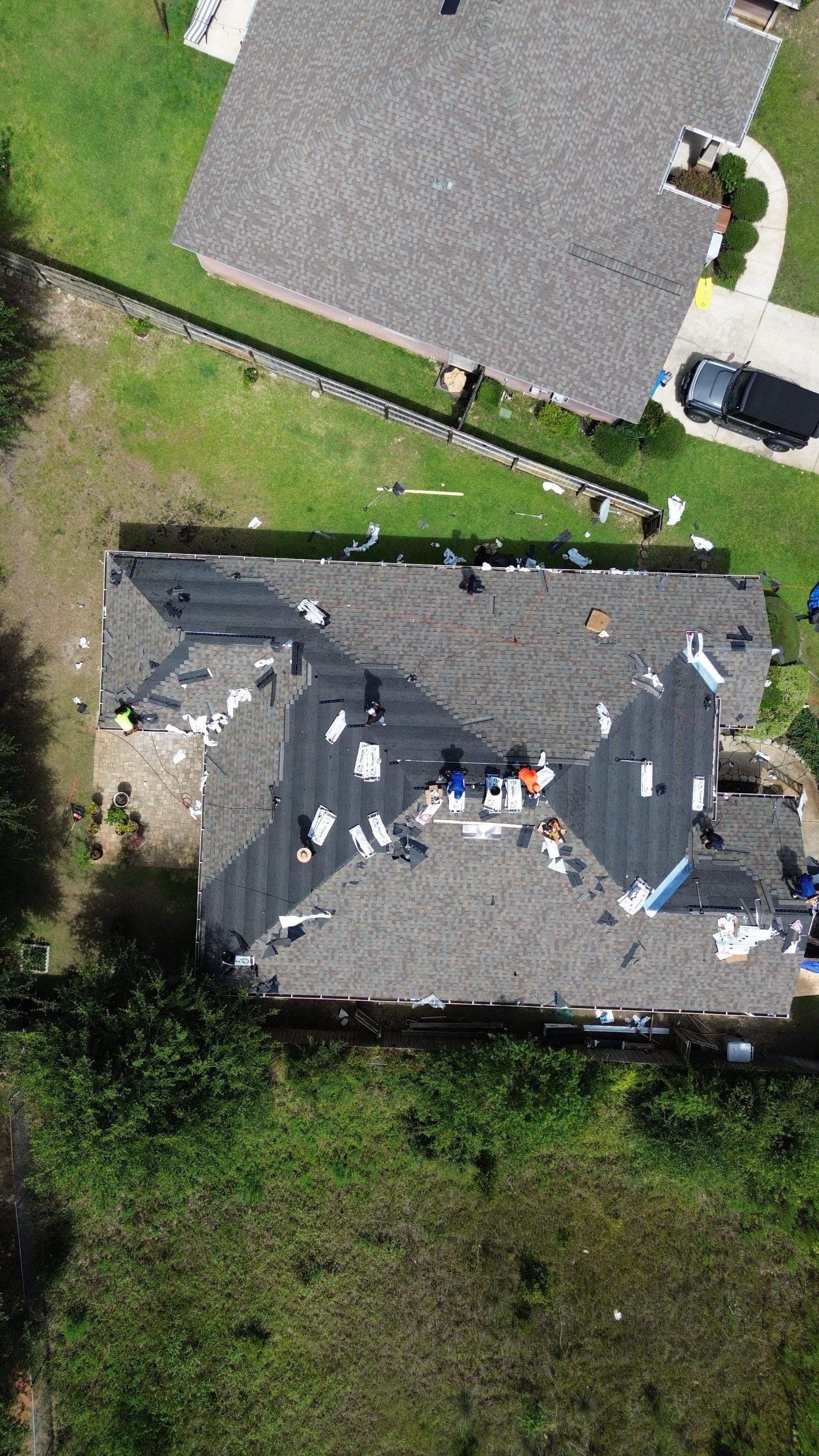 Crew drying in the exposed roof deck during tear-off