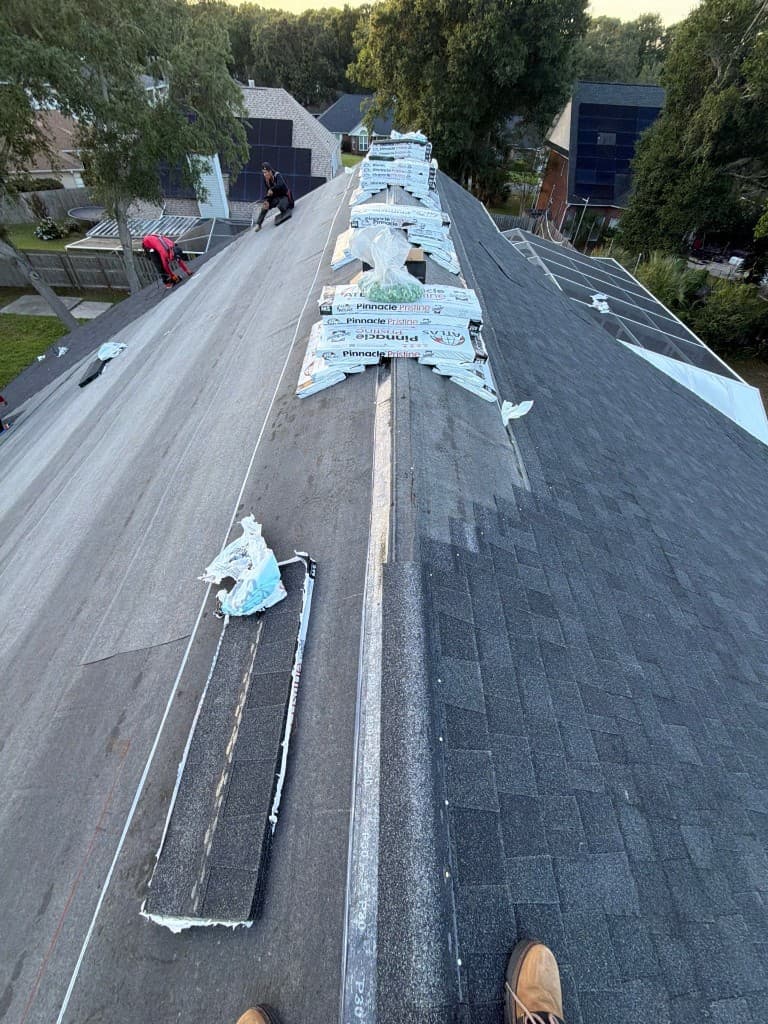 Professional installation of Atlas Pinnacle Pristine architectural shingles on a residential roof